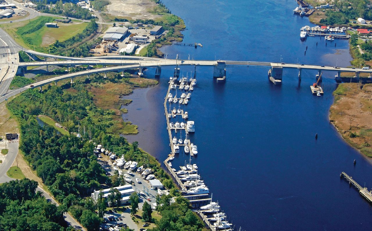 Aerial view of a Wilmington marina basin and docks beside the bridge