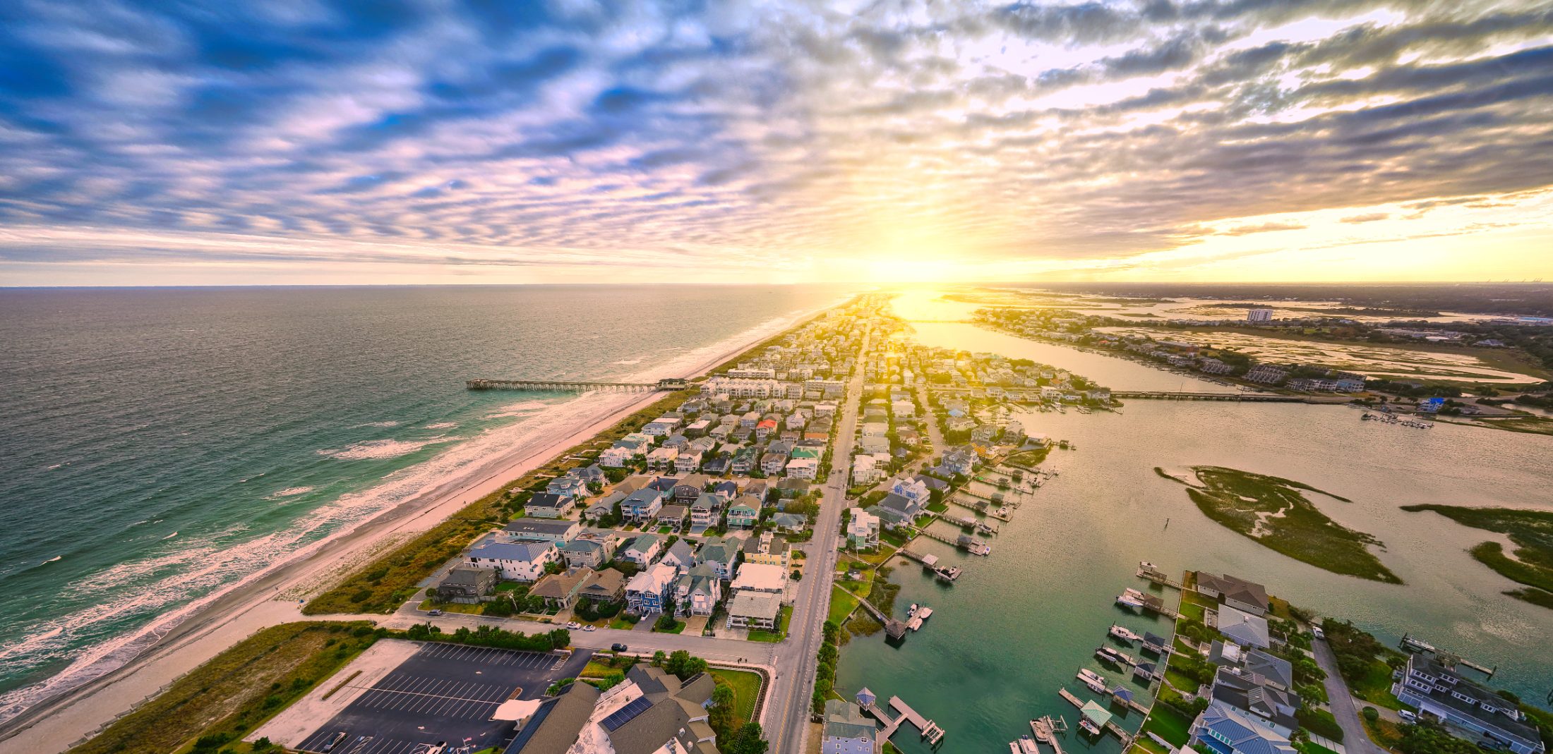 Wrightsville Beach at sunrise from the air, the pier and the ocean