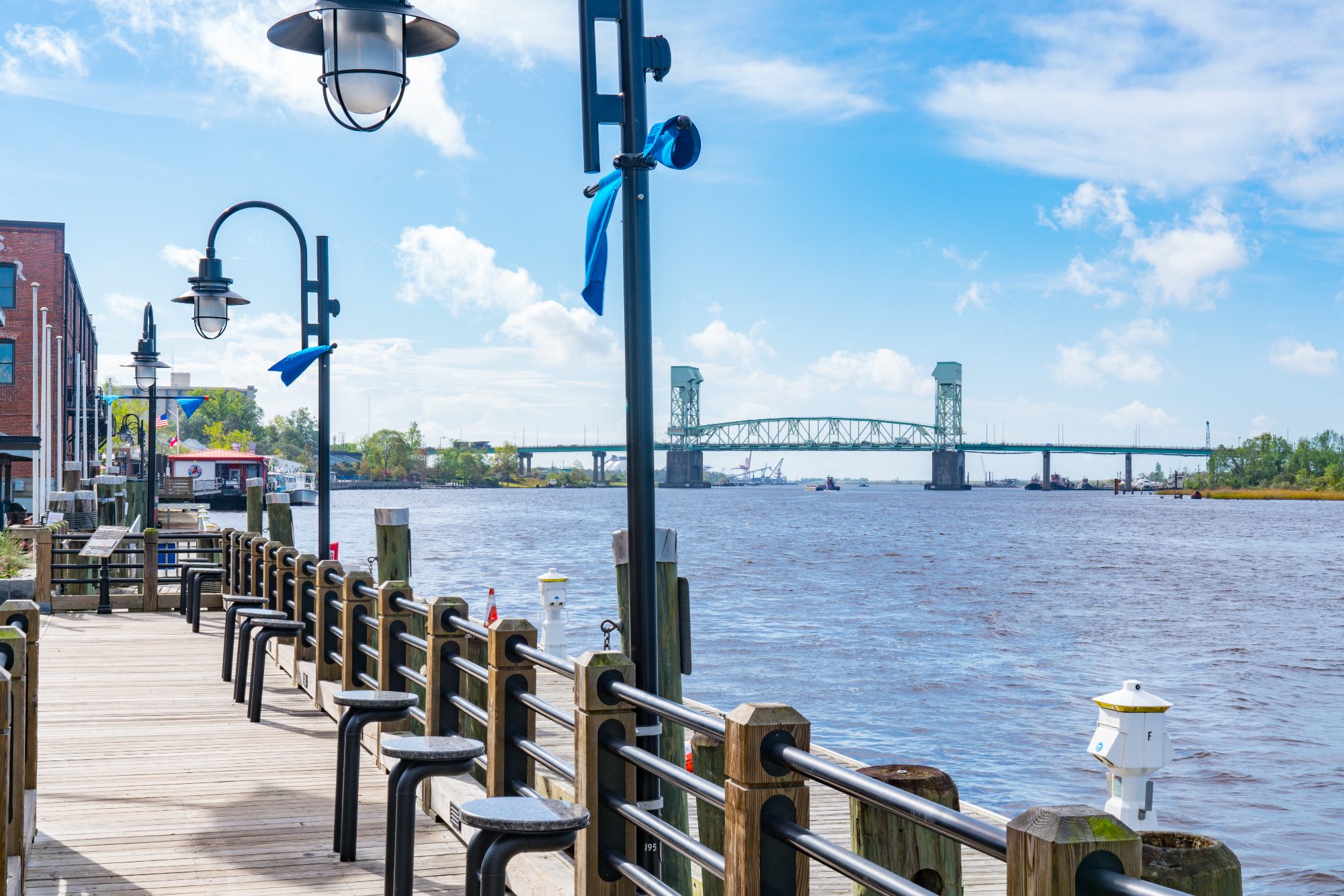 The Wilmington Riverwalk with the Cape Fear Memorial Bridge beyond